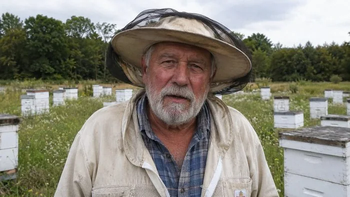 Barney Combs in his beeyard, Ozark County, Missouri
